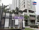 Exterior view of Lumini Megacity Bangna residential building with signage