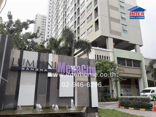 Exterior view of Lumini Megacity Bangna residential building with signage