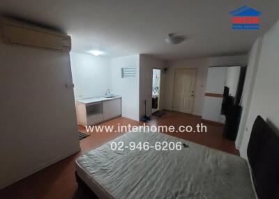 Spacious furnished bedroom with kitchenette