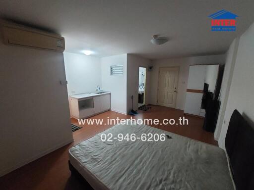 Spacious furnished bedroom with kitchenette