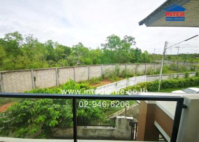 Spacious balcony with scenic views and surrounding greenery