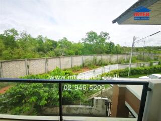 Spacious balcony with scenic views and surrounding greenery