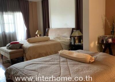Cozy and well-furnished bedroom with warm lighting and elegant design
