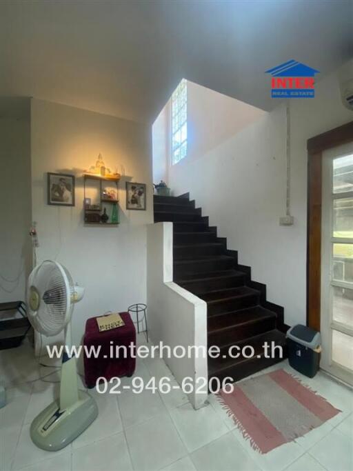 Bright stairway in a home with decorative elements.