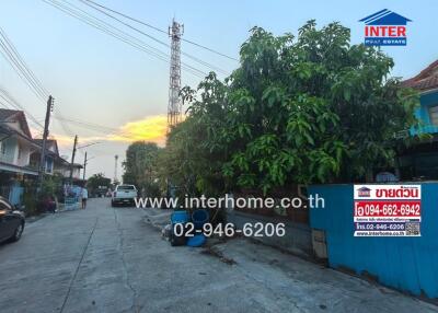 Street view outside the property showing surrounding area and sunset