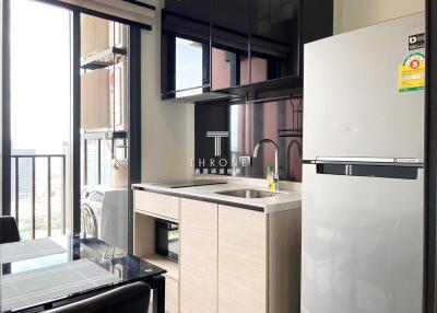 Modern kitchen with an expansive view, sleek cabinets, and premium appliances