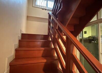 Interior staircase with wooden steps and railing