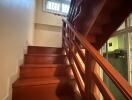 Interior staircase with wooden steps and railing