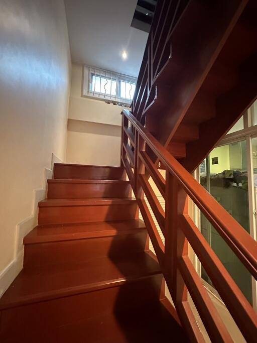 Interior staircase with wooden steps and railing