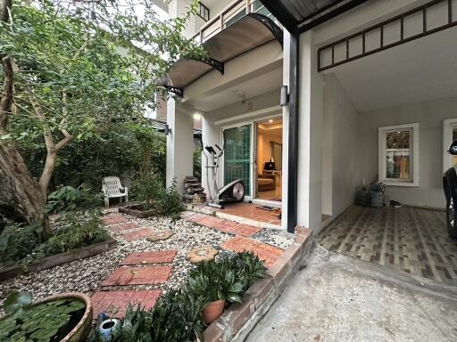 Spacious patio with garden and open entrance to the house