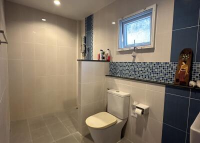 Modern bathroom interior with white and blue tiles