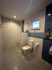 Modern bathroom interior with white and blue tiles