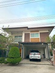 Modern two-story house with a covered carport