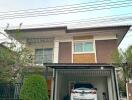 Modern two-story house with a covered carport