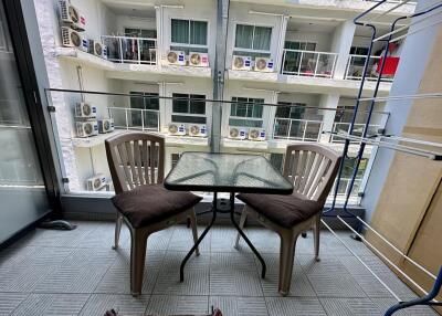 Cozy balcony area with table and chairs