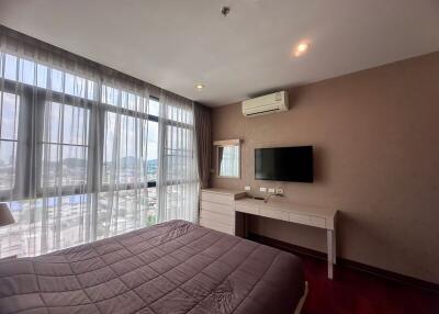 Spacious bedroom with modern amenities and scenic view