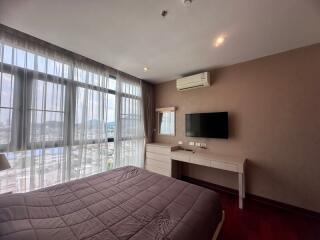 Spacious bedroom with modern amenities and scenic view