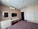 Spacious and well-lit bedroom with modern amenities