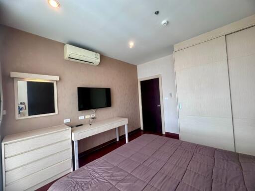 Spacious and well-lit bedroom with modern amenities