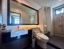 Modern bathroom with sleek fixtures and ample lighting
