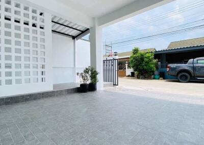 Spacious covered carport with modern design and tiled flooring