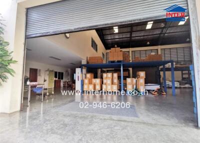 Spacious warehouse interior with organized storage and loading area