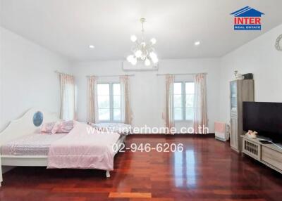 Spacious bedroom with natural light and modern amenities