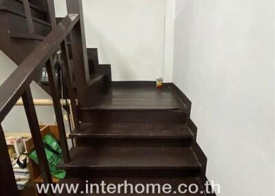 Dark wooden staircase in a modern home