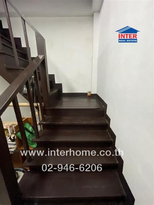 Dark wooden staircase in a modern home