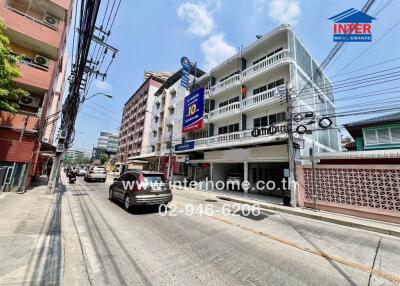 Exterior view of a commercial real estate building on a busy street