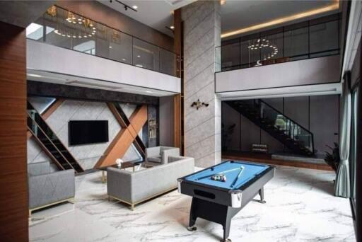 Luxurious modern living room with pool table and elegant decor