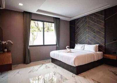Modern bedroom with elegant design and large window