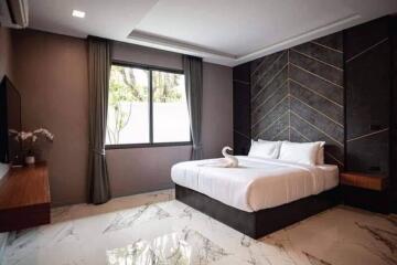 Modern bedroom with elegant design and large window
