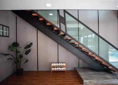 Modern staircase with glass railing in a stylish building