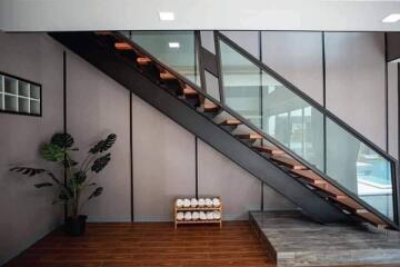 Modern staircase with glass railing in a stylish building