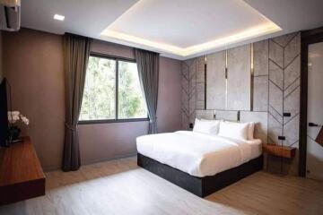 Modern bedroom with elegant design and ample lighting