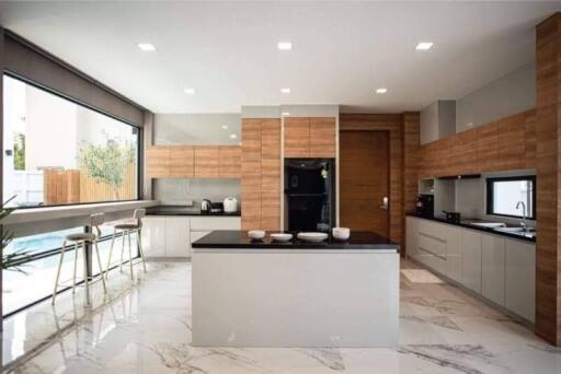 Modern kitchen with wooden cabinets and marble countertops