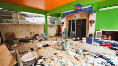 Cluttered and under renovation indoor space with bright green walls