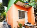 Orange exterior of a small residential building