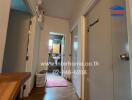 Cozy hallway leading to a bathroom in a residential home