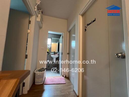 Cozy hallway leading to a bathroom in a residential home