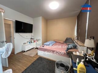 Compact and well-furnished bedroom with modern amenities