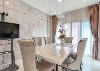 Elegant dining room with a modern table and comfortable seating
