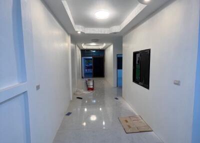 Modern hallway interior with bright LED lighting and marble flooring