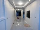 Modern hallway interior with bright LED lighting and marble flooring