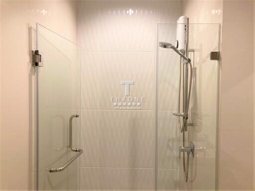 Modern bathroom with glass shower enclosure and elegant fixtures