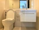 Modern bathroom interior with white fixtures and natural light