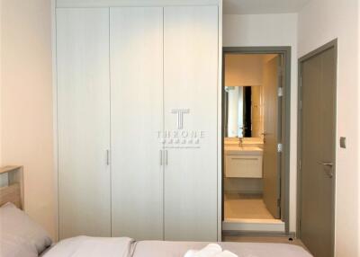 Modern bedroom with built-in wardrobe and en-suite bathroom