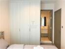 Modern bedroom with built-in wardrobe and en-suite bathroom