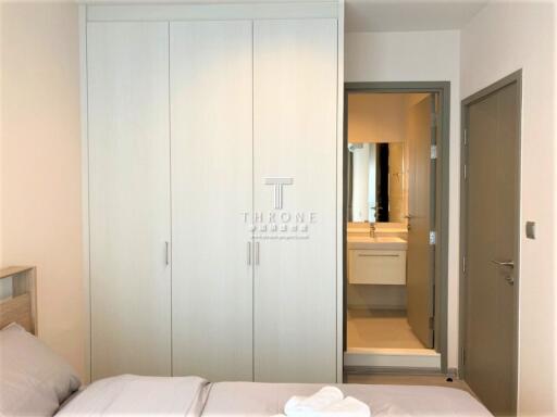 Modern bedroom with built-in wardrobe and en-suite bathroom